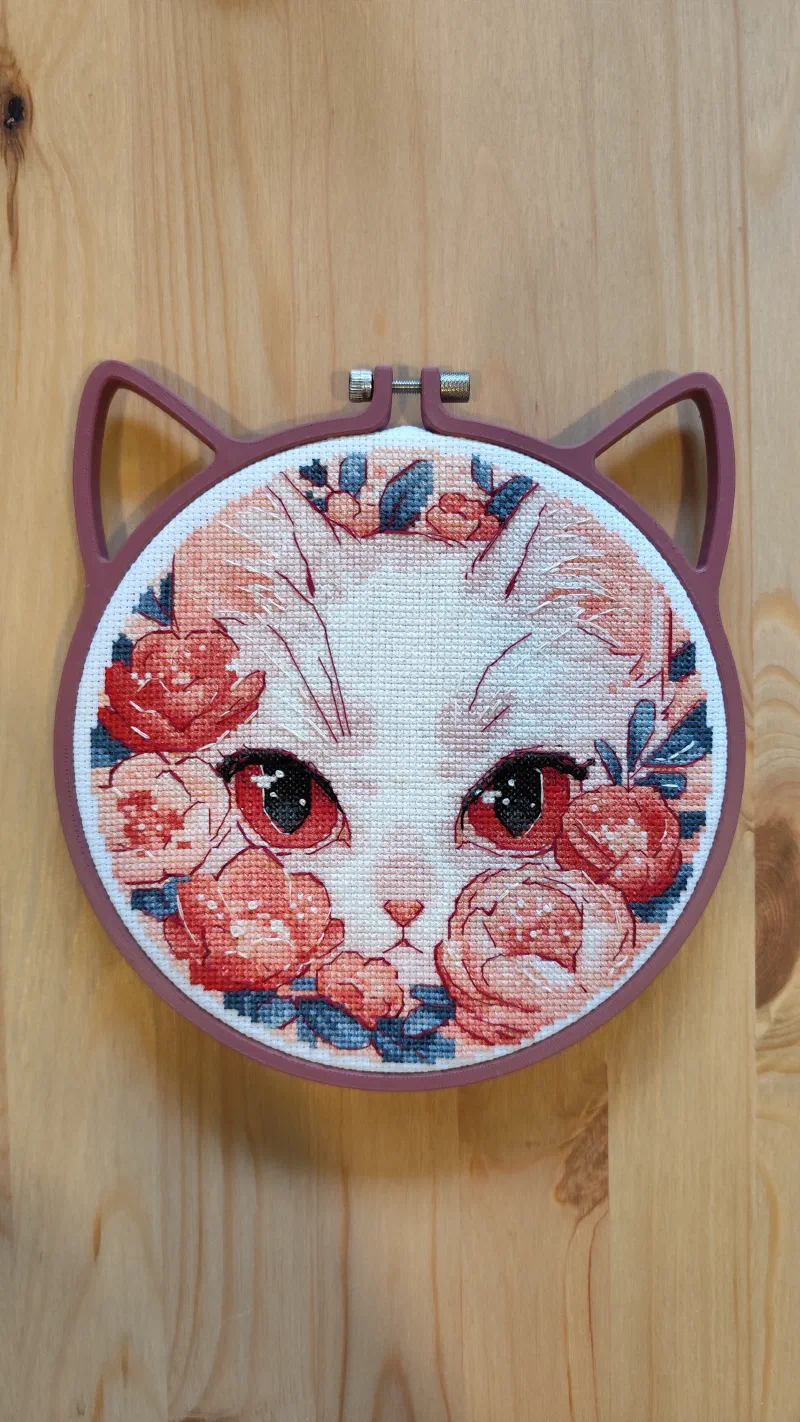 Cat pattern framed in a 3D printed cat style hoop.